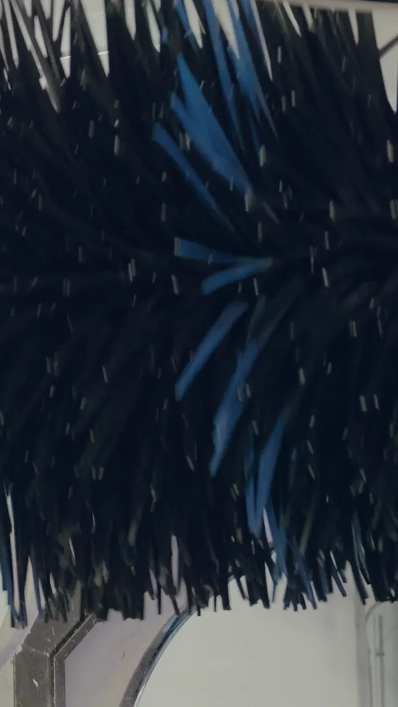 A close view of a spinning blue and black wash brush